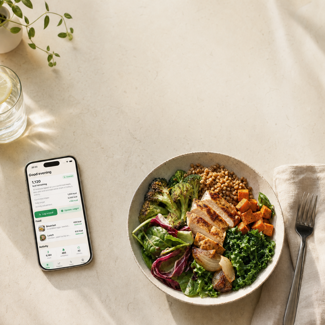 EatLose on an iPhone next to a balanced bowl of food